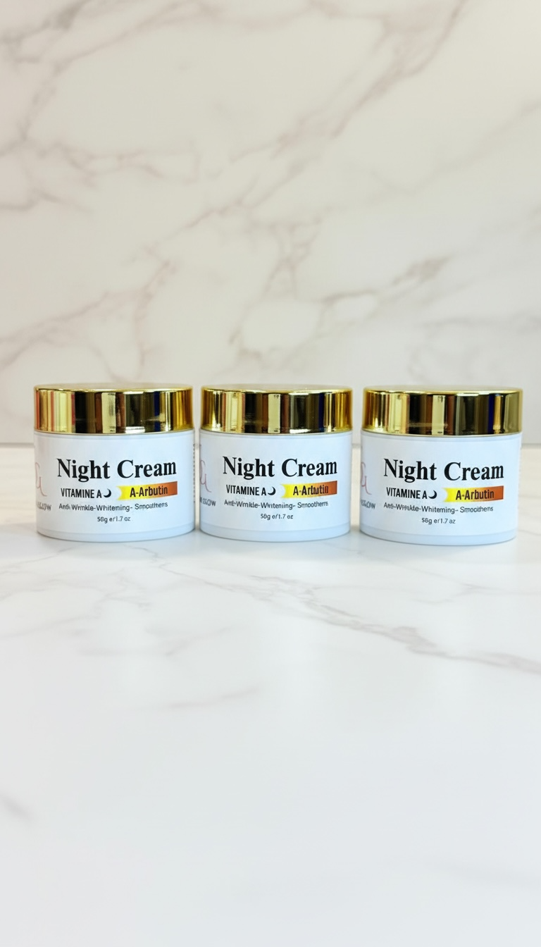 Three jars of night cream on a marble surface