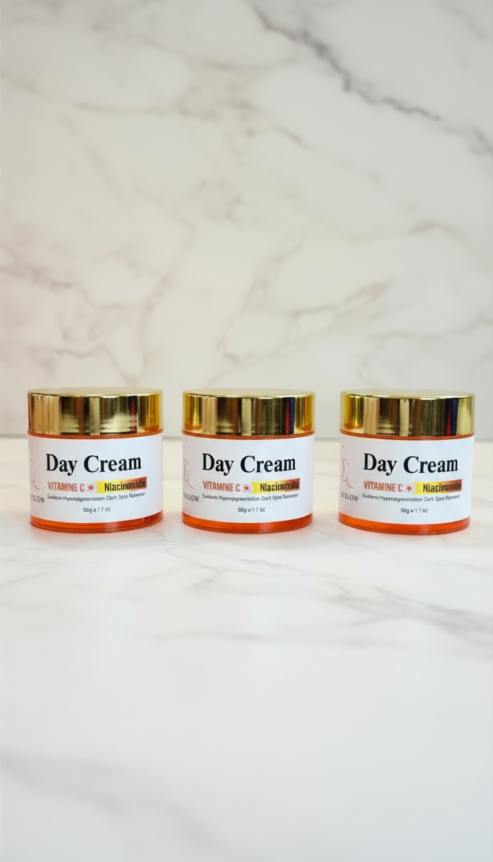 Three jars of day cream on a marble surface